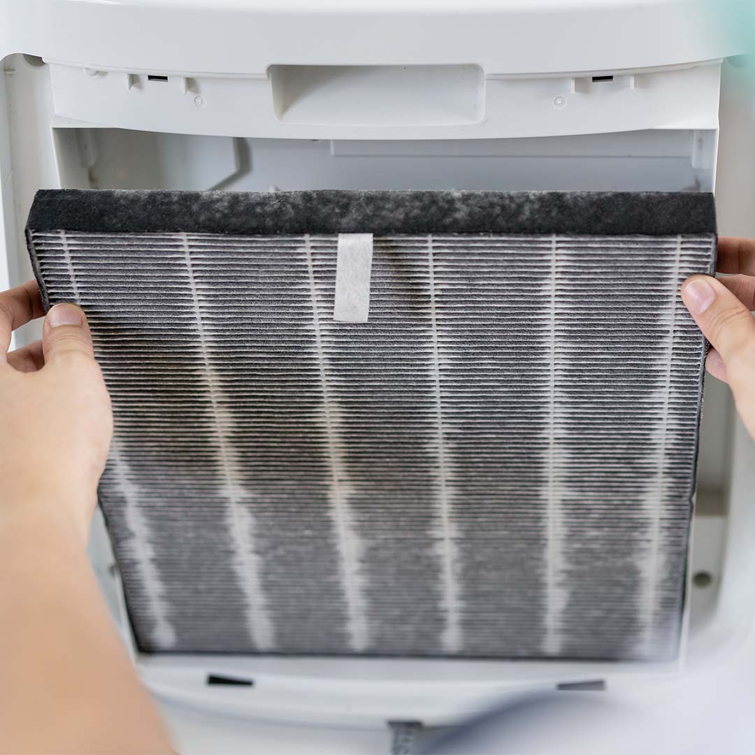 Person changing air filter